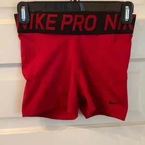 Red Nike pro compression shorts